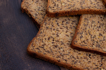 Bread slices on wooden oak table