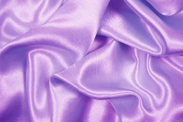 Beautiful purple satin luxury cloth texture can use as wedding background, fabric