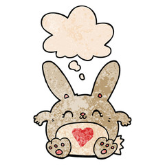 cute cartoon rabbit with love heart and thought bubble in grunge texture pattern style