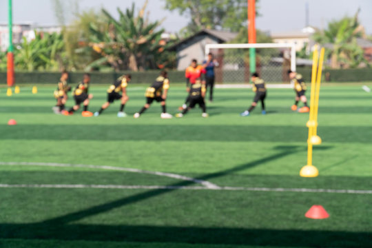 Blurred image for background of kids are training and playing soccer football.