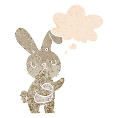 cute cartoon rabbit and thought bubble in retro textured style