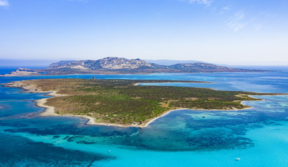 View from above, stunning aerial view of the Isola Piana island and the Asinara island bathed by a beautiful turquoise clear water. Stintino, Sardinia, Italy.