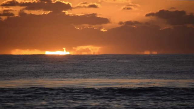 Long Shot of Golden sunrise on the open ocean