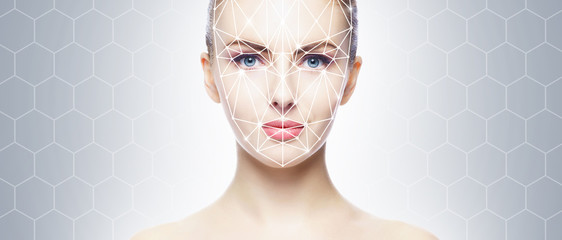Portrait of attractive woman with a scnanning grid on her face. Face id, security, facial...