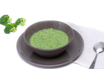 Vegetarian soup of broccoli puree on a white background. The concept of healthy eating.