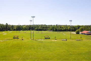 Aerial/Drone view of soccer/football field complex during the afternoon in Ontario, Canada.