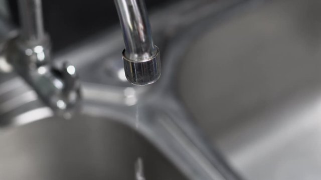 water leaking from faucet in kitchen