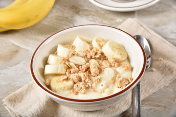 Bowl of yogurt with banana and granola
