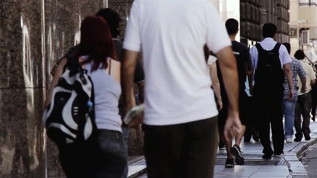 People Walking in a Street of Buenos Aires, near the Casa Rosada.