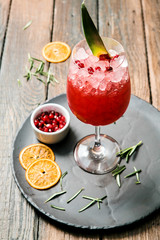 Lemonade or juice. Alcohol drink or cocktail. Images for bar or restaurant menu. Red drink with ice lemon and berries