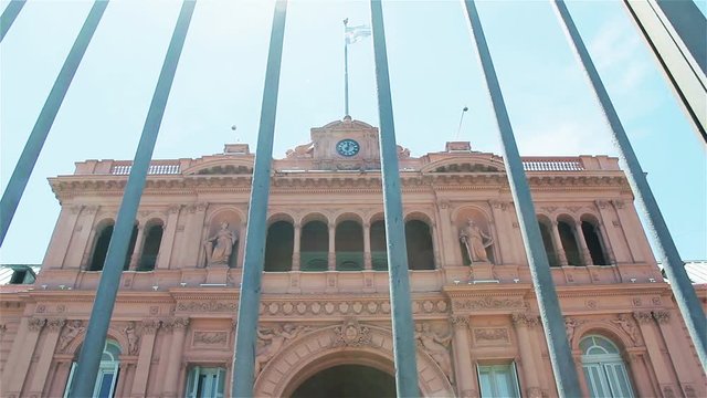 The Pink Facade of Casa Rosada Presidential Palace in Plaza de Mayo, Buenos Aires, Argentina - Dolly Out 