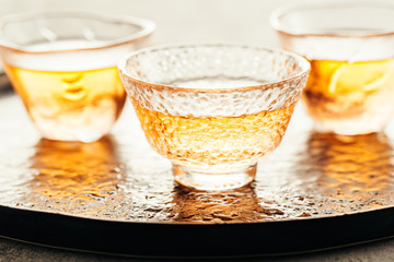 Fresh tea in glass cups on tray