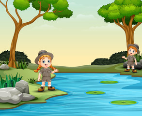 Obraz na płótnie Canvas Scout boy and girl talking by the river