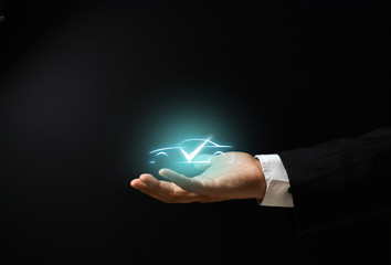 Businessman's hand on black background