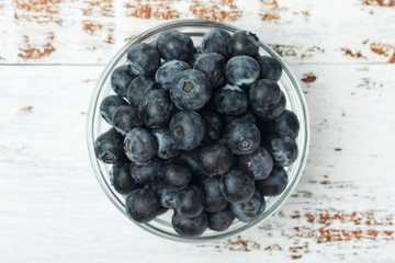 A glass bowl with blueberry	