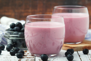 Two glasses with blueberry yogurt	