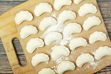 The process of cooking traditional vareniki - textured background