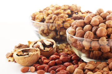 Different nuts in glass cups