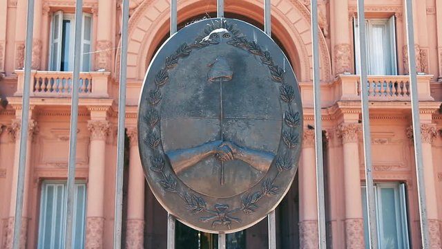 Casa Rosada (Pink House), Presidential Palace in Buenos Aires, Argentina, with National Emblem. Zoom Out.