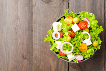 Vegetarian salad on wooden background