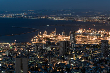 Panoramic view of downtown Haifa, Haifa harbor and bay at night. View from Mount Carmel
