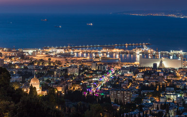 Panoramic view of downtown Haifa, Haifa harbor and bay at night. View from Mount Carmel