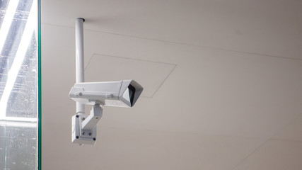 CCTV camera in the subway room, public place, security and video surveillance.