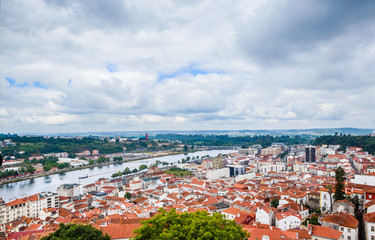 Cityscape over the roofs of Coimbra with the Mondego River, Portugal