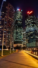 Fototapeta premium Night shot in front of skyscrapers of the financial district of Singapore. Buildings in front of the Bahia lake.