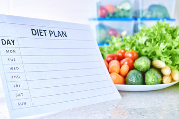 A meal plan for a week on a white table among set of plastic containers for food and food. Proper nutrition during the week.