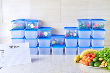 A meal plan for a week on a white table among set of plastic containers for food and food. Proper nutrition during the week.