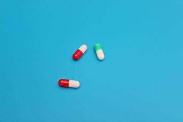 Pharmacology pills on blue background