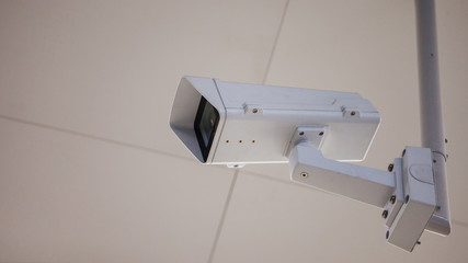 CCTV camera in the subway room, public place, security and video surveillance.