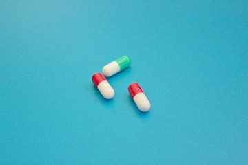 Pharmacology pills on blue background