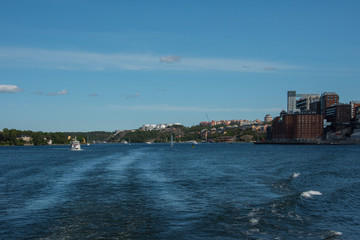 Fototapeta na wymiar Houses and landscape at the inner harbor of Stockholm a summer day. 