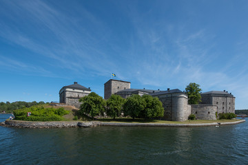 The pier and fortress at the town Vaxholm in Stockholm archhipelago a summer day