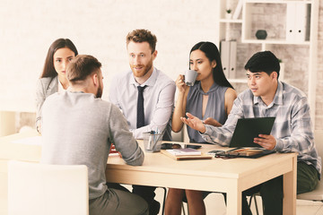 Human resources commission interviewing man in office