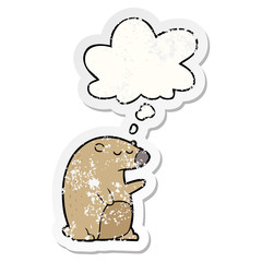 cartoon bear and thought bubble as a distressed worn sticker