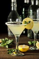 Margarita cocktail, Alcoholic drink, margarita cocktail with lemon and mint and salt on a wooden table. bar. bar stock and accessories.