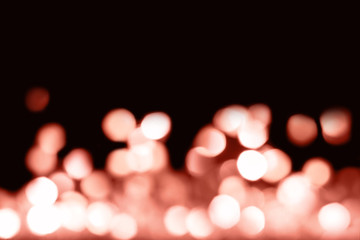 Abstract festive background with falling coral lights. Holiday concept