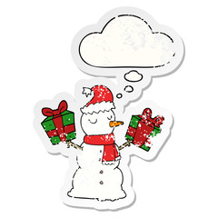 cartoon snowman and thought bubble as a distressed worn sticker