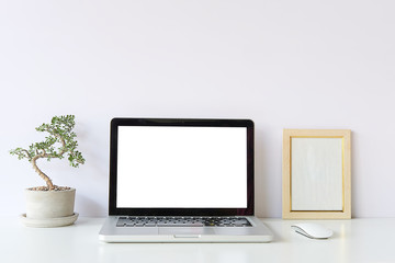 Fototapeta premium Workspace desk and laptop. copy space and blank screen. Business image, Blank screen laptop and supplies.