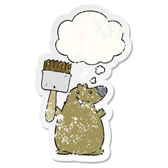 cartoon bear with paint brush and thought bubble as a distressed worn sticker