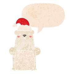cartoon bear wearing christmas hat and speech bubble in retro textured style
