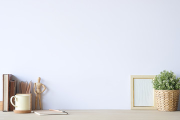 Mockup workspace desk and copy space books,plant and coffee on white desk.