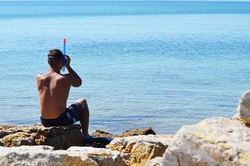 Close-up man in diving mask at the sea coast, summer rest,photo