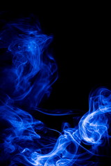 Fototapeta premium Blue smoke on black background