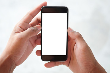 Cropped shot view of man hands holding smart phone with blank copy space screen for your text message or information content, female reading text message on cell telephone during in urban setting. 