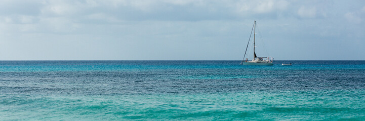 Yacht in blue ocean, panorama