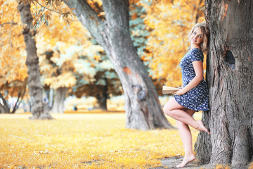 Beautiful girl in the autumn park